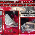 RM131-Beautiful girl does not move and does not breathe in vacuum plastic