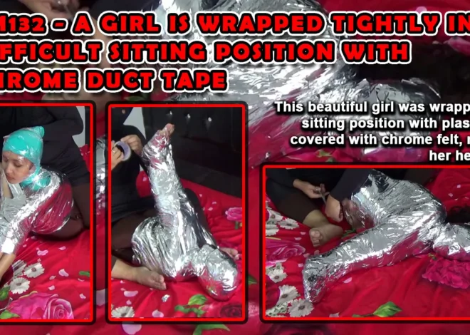 RM132-A girl is wrapped tightly in a difficult Sitting position with chrome duct tape